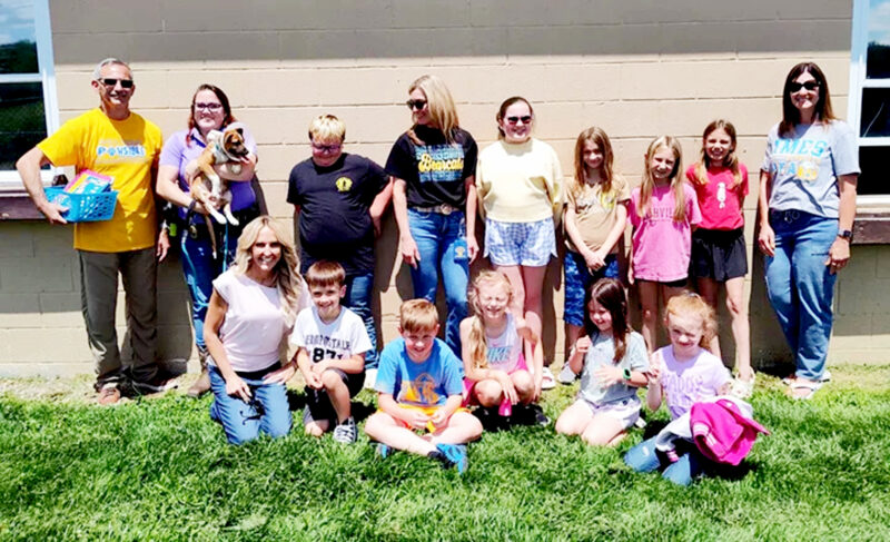 Top student readers turn pages into playtime for shelter animals
